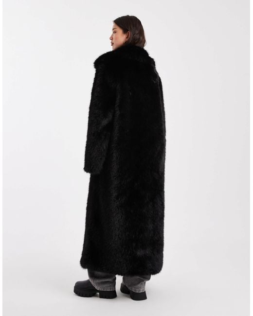 Manteau long en fausse fourrure avec liseré ASOS en coloris Black