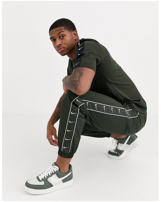 Jogger a logo virgule avec chevilles resserrees et bandes Kaki Nike pour homme en coloris Vert Lyst