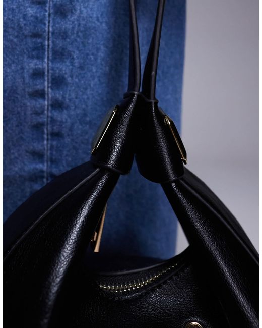 ASOS Black Interchangeable Shoulder And Cookie Clutch Bag With Eyelet Studs