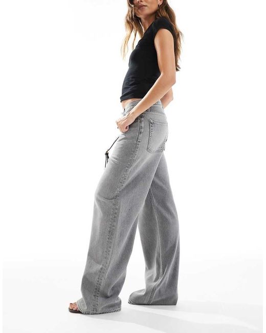 Jeans Larghi A Vita Bassa Slavato di Calvin Klein in Gray