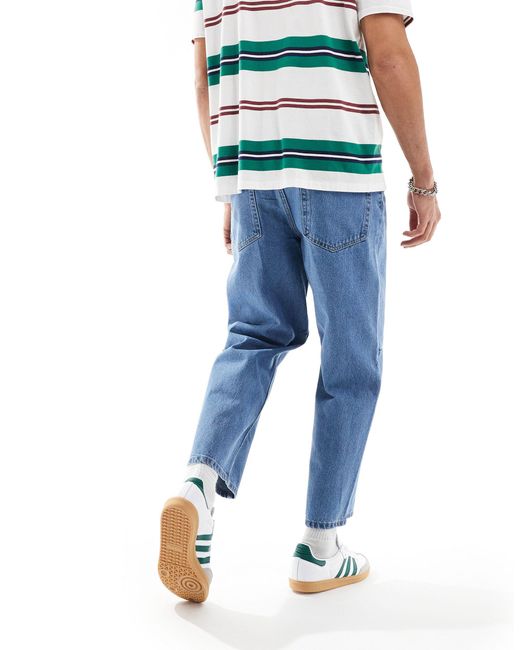 Jeans rigidi classici con pinces lavaggio medio di ASOS in Blue da Uomo
