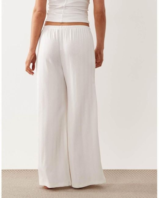 ASOS White Asos Design Petite Pointelle Wide Leg Pyjama Trousers With Rosebud Trim