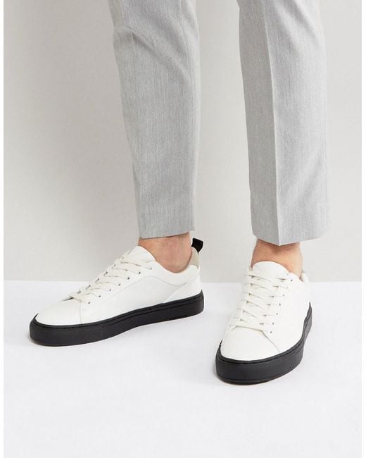 ASOS Trainers In White With Contrast Black Sole for men