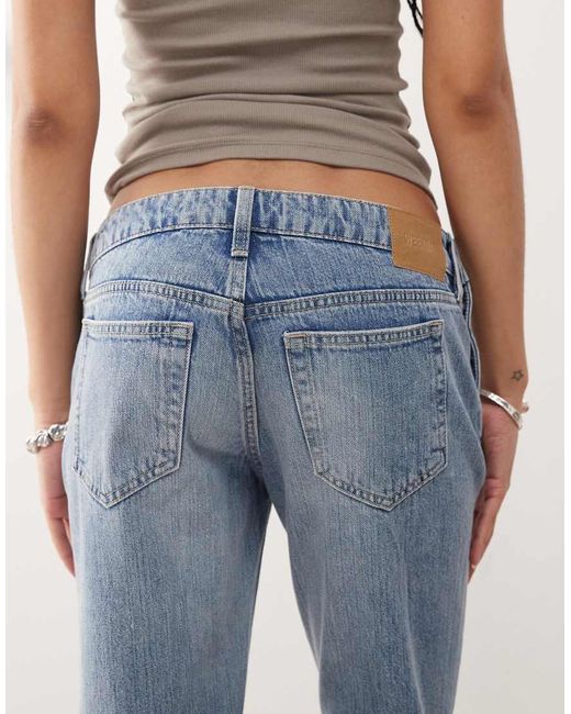 Weekday Flared Jeans Met Lage Taille En Westerndetail Met Knopen Aan De Zijkant in het Blue