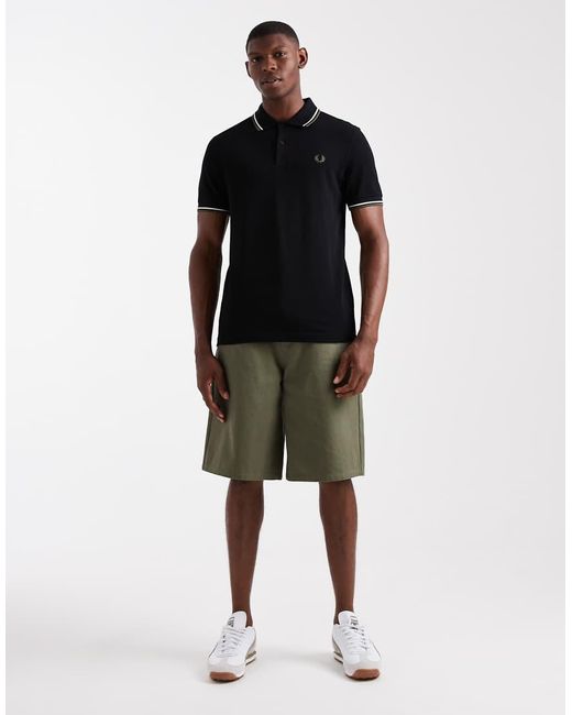 Polo Nera Con Righe Doppie A Contrasto Su Maniche E Colletto di Fred Perry in Black da Uomo