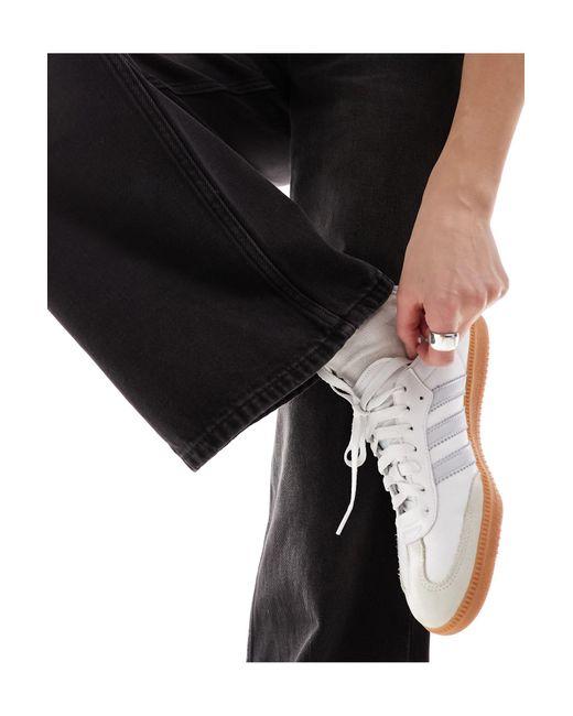 Imoo - jean ample taille basse - délavé Monki en coloris Black