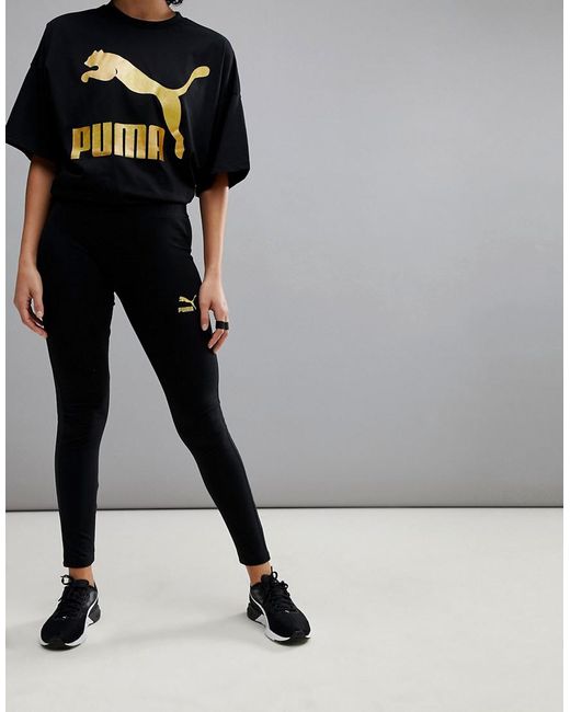 PUMA Leggings With Gold Logo in Black