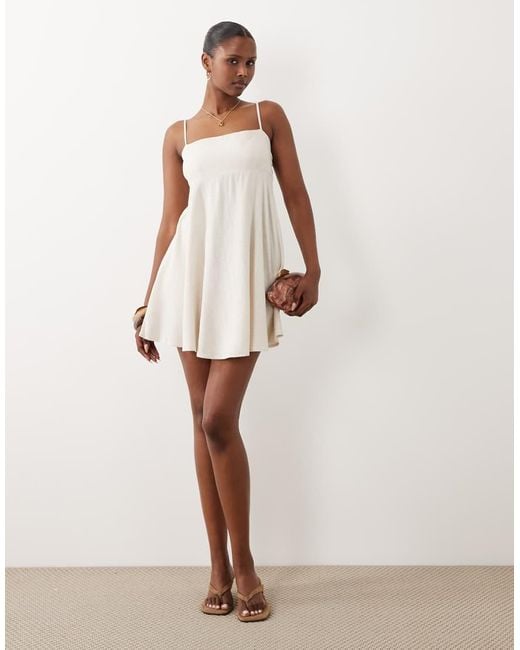 The Frolic White Exclusive Linen Look Square Neck Cinched Open Back Detail Floaty Mini Dress