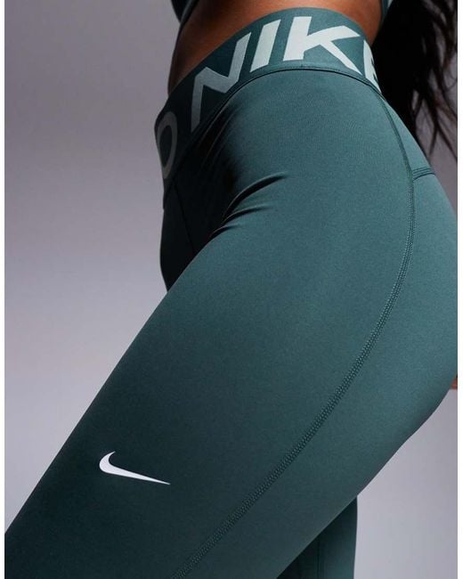 green nike leggins