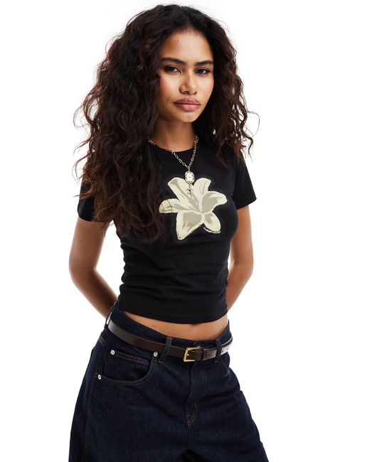 T-shirt délavé à manches courtes et imprimé fleur Reclaimed (vintage) en coloris Black