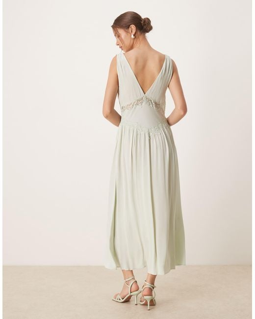 Robe mi-longue avec col v et détail en dentelle - pâle Mango en coloris Natural