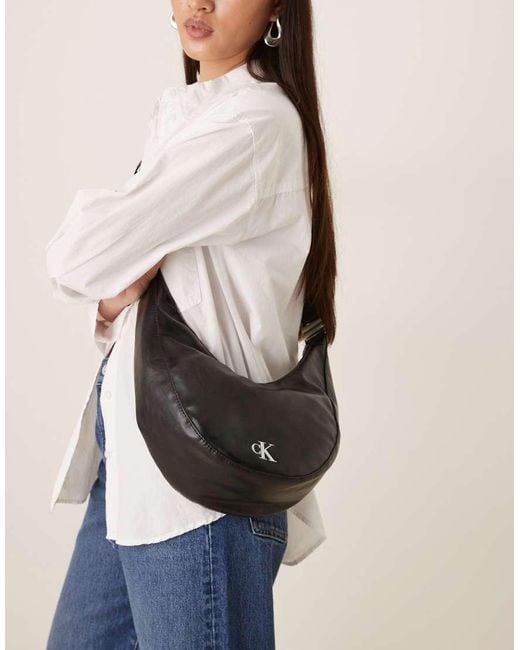 Calvin Klein Natural Glossy Convertible Buckle Moon Bag