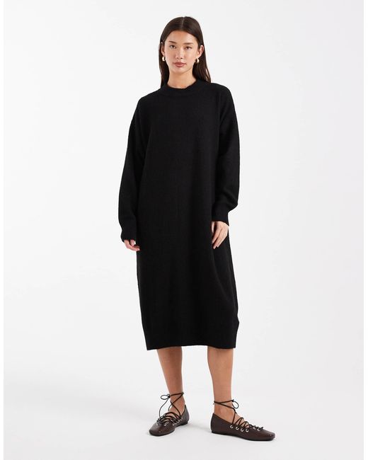 Robe pull mi-longue en maille avec manches longues Monki en coloris Black