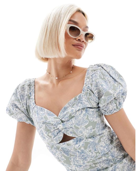 Robe courte tendance folk à manches bouffantes en lin - à imprimé fleurs Brave Soul en coloris White
