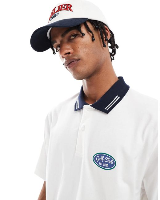 Polo décontracté avec imprimé golf à l'avant ASOS pour homme en coloris White