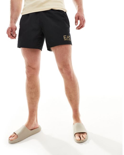 Armani - pantaloncini da bagno neri con logo dorato di EA7 in Black da Uomo
