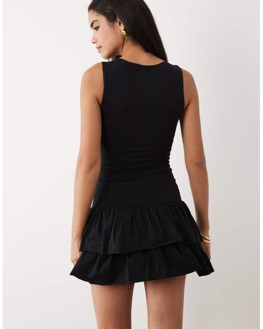 Fashionkilla Black Exclusive Cotton Rich Sleeveless Drop Waist Ruffle Hem Mini Dress