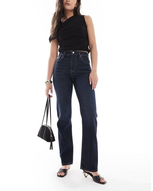 Jeans Dritti A Vita Alta Color Indaco di Calvin Klein in Blue