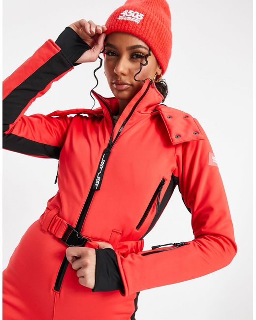 ASOS 4505 – figurbetonter skianzug mit kapuze, streifen seitlich und gürtel  in Rot | Lyst DE