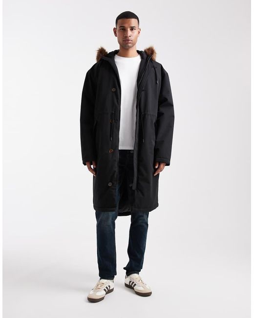 Chaqueta De Plumas Negra Extragrande Con Capucha De Piel Sintética De ASOS de hombre de color Black