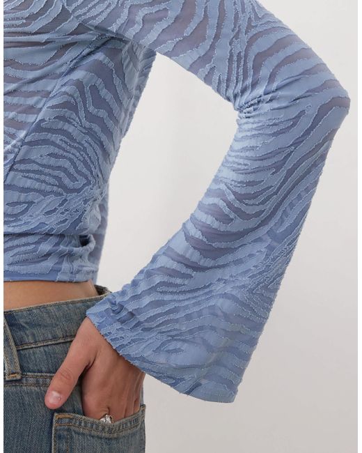 Reclaimed (vintage) Blue Zebra Burnout Flare Sleeve Top