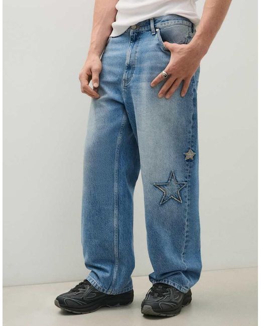 Bershka Blue baggy Jeans With Print And Patches for men
