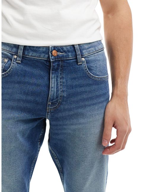 Jeans stretch slim lavaggio medio di ASOS in Blue da Uomo