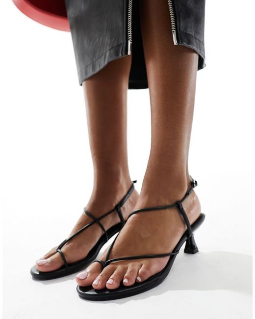 Ark - sandali con tacchetti a spillo e listini neri di Public Desire in Black
