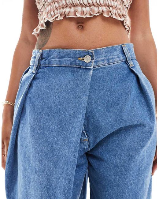 Vaqueros Medio De Pernera Ancha Con Detalle Cruzado De ASOS de color Blue