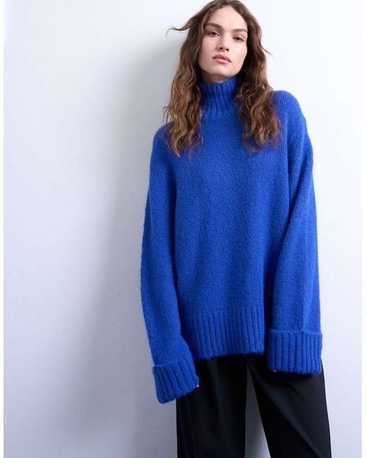 TOPSHOP Blue – hochgeschlossener longline-strickpullover mit ausschnitt-detail und oversize-passform