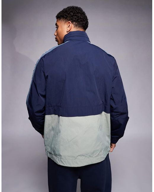 EA7 Blue Armani Panelled Wind Breaker Jacket With Logo Tape Detail for men