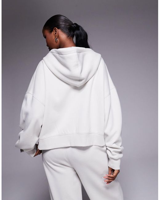 Sweat à capuche d'ensemble en coton majoritaire à fermeture éclair et broderie logo - clair Kaiia en coloris Gray