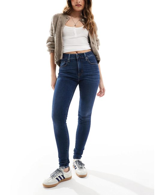 721 - jean skinny à taille haute - délavage moyen Levi's en coloris Blue