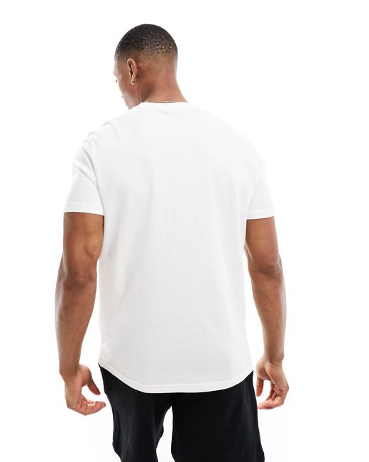 T-shirt confort avec rayures et monotype Tommy Hilfiger pour homme en coloris White
