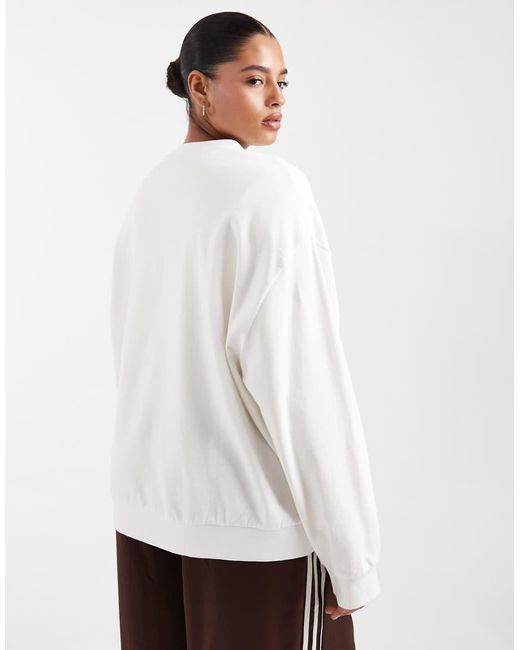ASOS White Asos Design Curve Oversized Sweatshirt With Pilates Studio Graphic