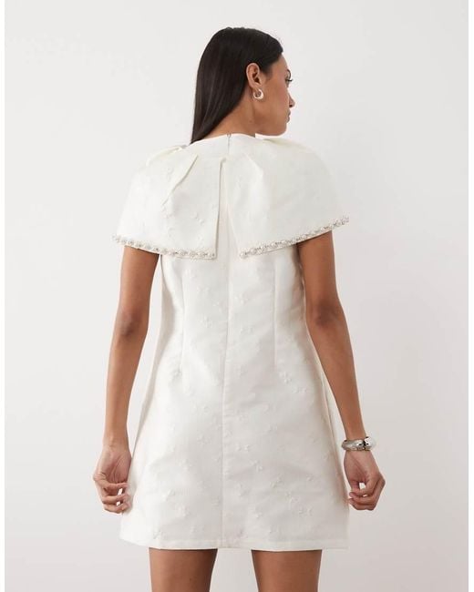 Sister Jane White Bridal Detachable Cape Detail Pearl Embellished Mini Dress