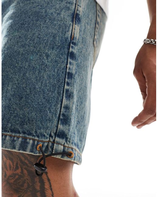 Short en jean mi-long coupe cargo ample à enfiler - moyen délavé ASOS pour homme en coloris Blue