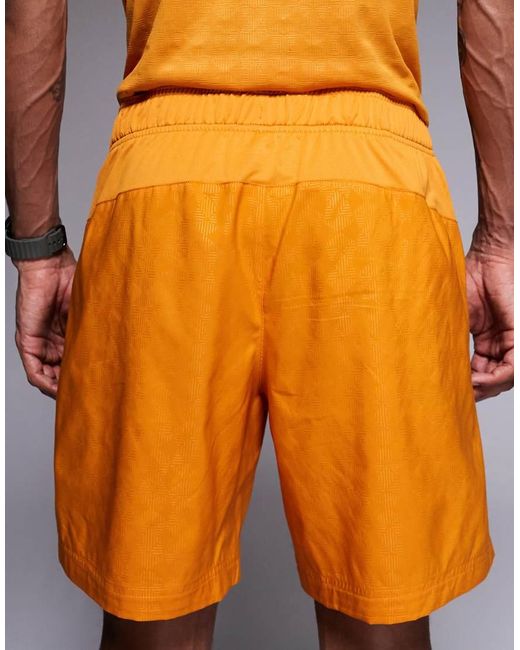 The North Face Orange Pentadome Embossed 24/7 Logo Short for men