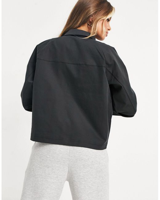 nike swoosh woven utility jacket in black