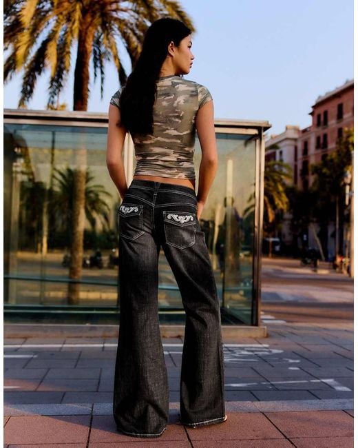 Bershka Black Petite Embroidered Low-Rise Flared Jeans