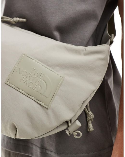 The North Face Never Stop Sling Cross Body Bag in Gray for