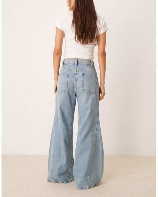 Vaqueros De Campana De Talle Alto Y Corte Holgado Con Lavado Azul Medio Eden De Free People de color Blue