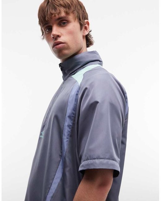 Umbro Blue Zip Off Sleeve Wind Jacket for men