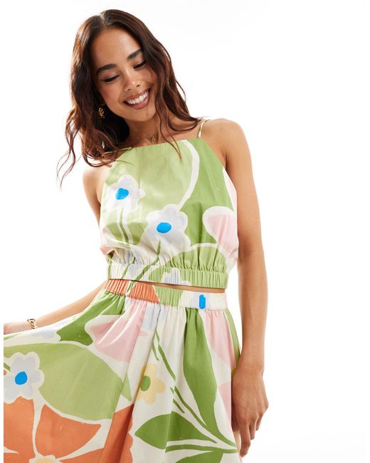 Top corto con cuello halter y estampado floral abstracto luminoso ASOS de color Green