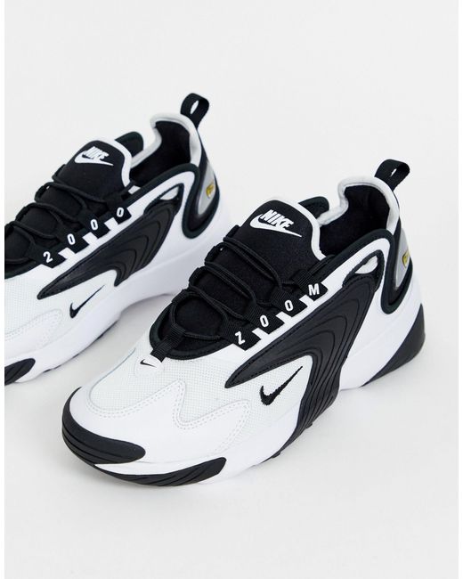 white & black zoom 2k trainers