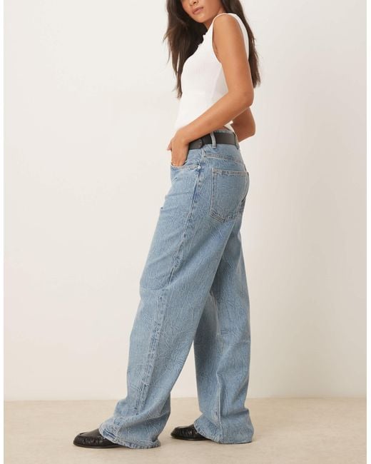 Jean baggy en coton texturé à taille basse - clair Mango en coloris Blue