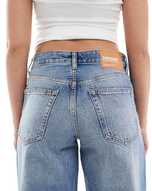 Vaqueros Azul Cielo Desgastado De Talle Bajo Y Pernera Ancha Acampanada Con Diseño Rasgado Rhue De Dr. Denim de color Blue