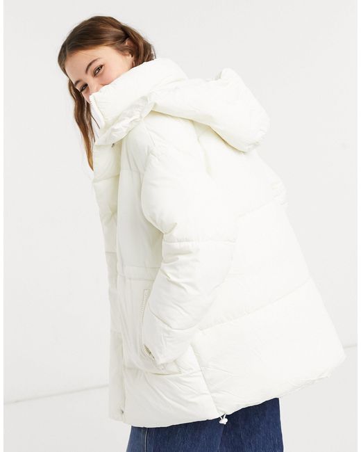 monki amber recycled short padded jacket with hood in blue