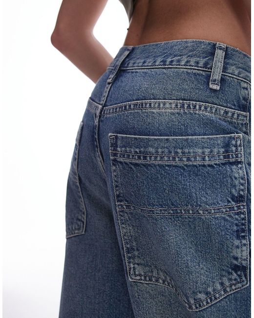 Jeans ampi medio a vita alta con macchie effetto fango di TOPSHOP in Blue