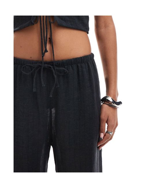 Mia - pantalon d'ensemble en maille pointelle - pur Weekday en coloris Black